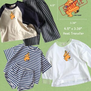 May include: A collection of clothing featuring a bear graphic with the text GONE FISHIN'. Includes a raglan shirt, striped pants, a striped t-shirt, striped shorts, and a white long-sleeve shirt. A heat transfer graphic measures 4.5 inches by 3.39 inches.