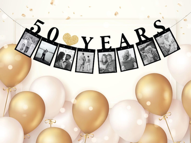 May include: Black and white photo banner with gold glitter heart and the text "50 YEARS". The banner is strung with black string and has 8 photo frames. The banner is hanging against a white background.
