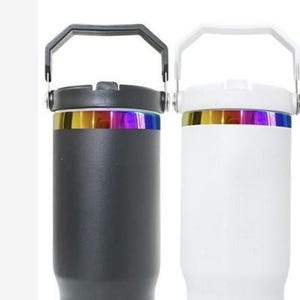 May include: Two insulated tumblers, one black and one white, each with a handle and a colorful iridescent band. The word "black" is above the black tumbler, and "white" is above the white tumbler.