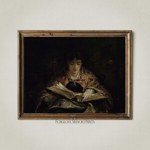 May include: A painting of a person in a dark setting, wearing a colorful robe and reading a book. The painting is framed in a gold frame.