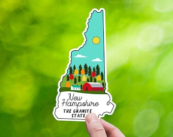 May include: A sticker of the state of New Hampshire, featuring a blue sky with white clouds, a yellow sun, and a green forest with a red barn. The text "New Hampshire THE GRANITE STATE" is printed below the image.
