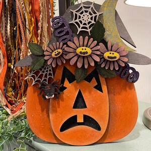 Halloween pumpkin scared face svg digital file with the layers to the detail it comes to life from the scary flowers to the spider