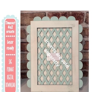 May include: A wooden picture frame with a scalloped edge in light blue and a white frame. The centre features a diamond lattice design in light blue. The text "Inserts are sold separately" is visible.