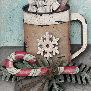 May include: A wooden Christmas-themed decoration featuring a mug of hot chocolate with marshmallows and a candy cane. A snowflake and a candy cane are in the foreground. The mug is brown and white with a black rim and handle.