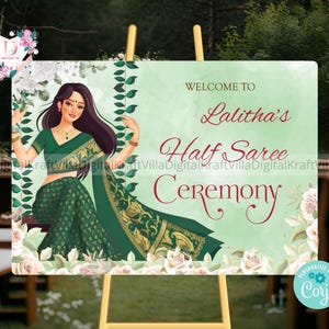 May include: A welcome sign for a Half Saree Ceremony. The sign features an illustration of a woman in a green saree, with the text "Welcome to Lalitha's Half Saree Ceremony" in red and green. White roses and green vines decorate the sign.