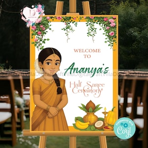 May include: A welcome sign for Ananya's Half Saree Ceremony. The sign features a cartoon illustration of a woman in a yellow sari. The sign is decorated with floral vines and traditional Indian elements, including a pot, bananas, and coconuts.