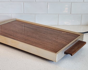 MCM electric warming tray with wooden handles and metal trim, wood grain top, midcentury, kitchen appliance, food warmer