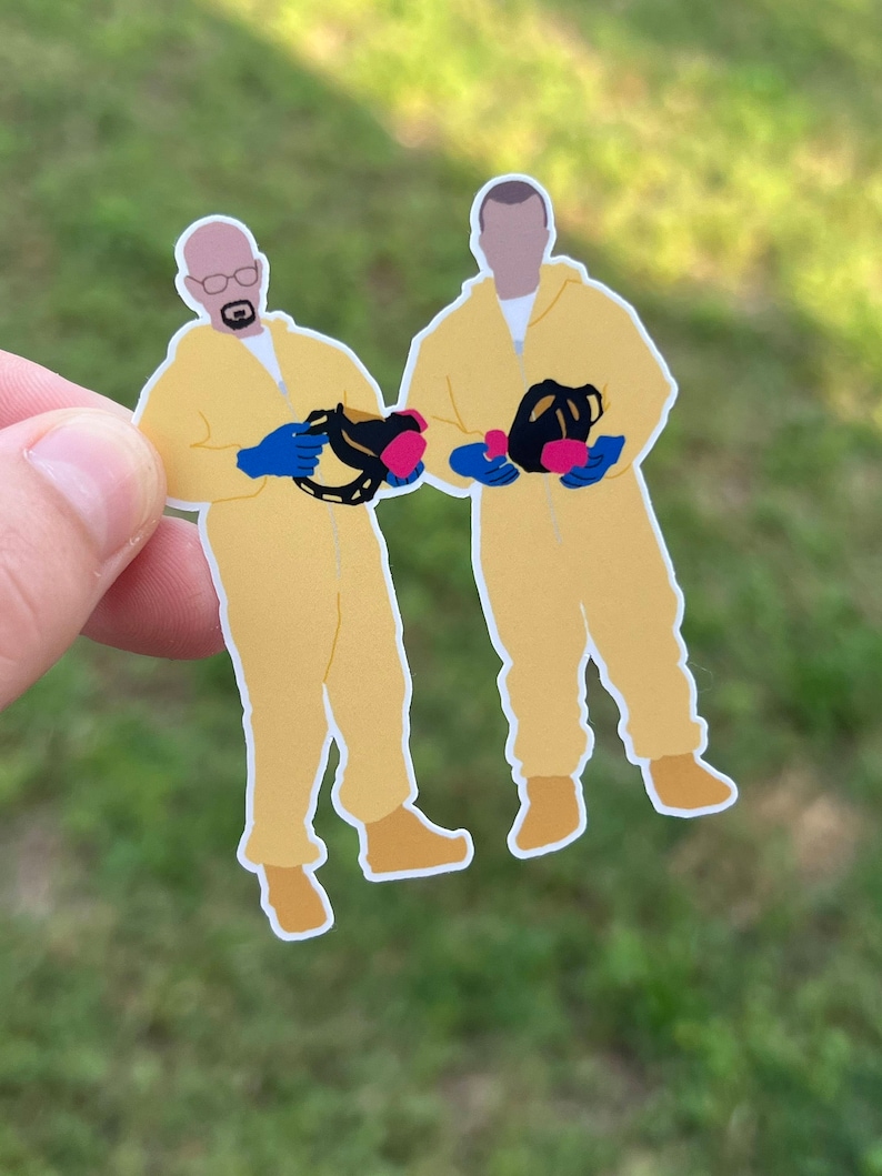 May include: Two figures wearing yellow jumpsuits and blue gloves, holding black gas masks with pink filters. The figures are standing side-by-side.