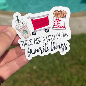May include: White sticker with a red shopping cart, a cup of iced coffee with whipped cream, and a bag of Chick-fil-A waffle fries. The text reads "These are a few of my favorite things."