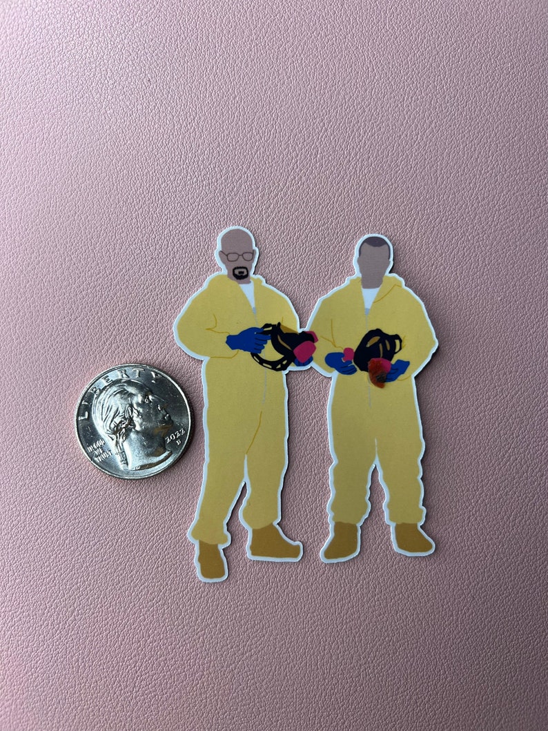 May include: Two cartoon figures wearing yellow hazmat suits and gas masks. The figures are holding red and blue objects. The figures are standing on a pink background.