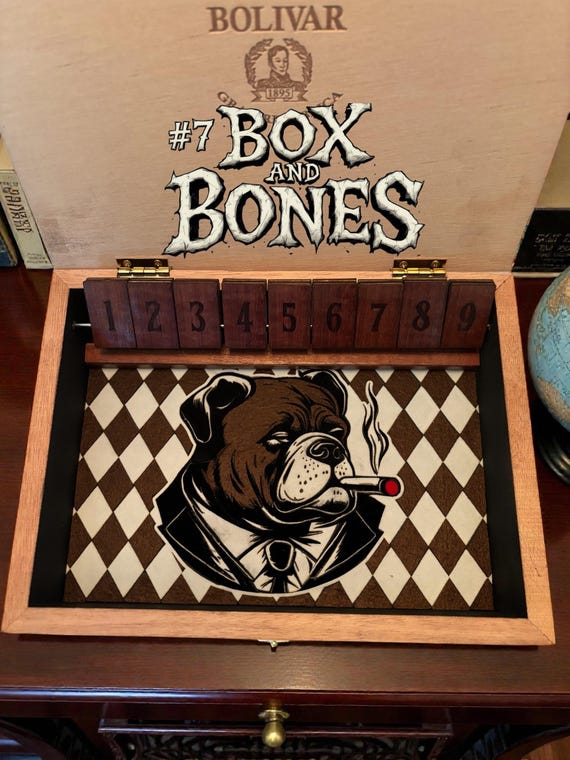 A handcrafted, genuinely one-of-a-kind 'Shut the Box' dice game built inside a real vintage cigar box — a playable art artifact you can't find anywhere else.