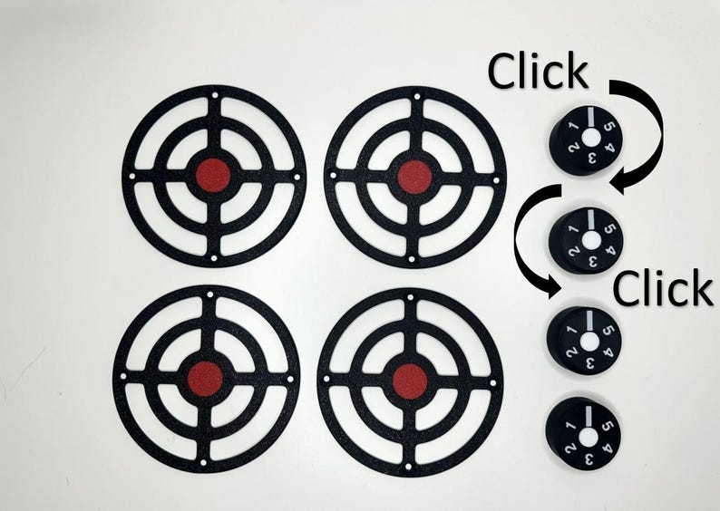 May include: Four black circular target frames with red centers arranged in a square grid, accompanied by four small black cylindrical knobs. Each knob features white numbers 1 through 5 and a white indicator line, with the text Click visible.
