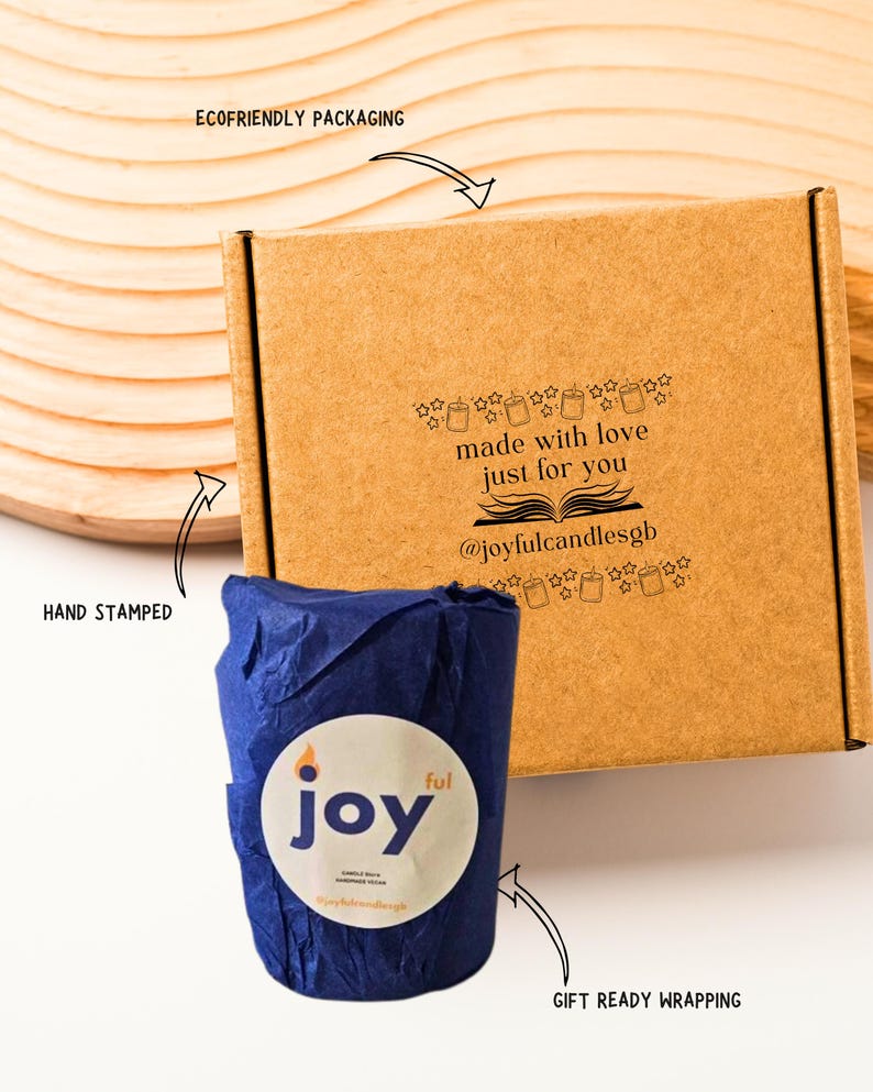 May include: A brown cardboard box with black text reading made with love just for you and @joyfulcandlesgb, accompanied by a blue tissue-wrapped item featuring a circular white label with the text joy ful.