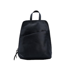 May include: A black backpack with a textured surface, featuring a top handle, a main zippered compartment, and a diagonal zippered pocket on the front. The design includes a slim silhouette with a rounded top and a flat base for stability.