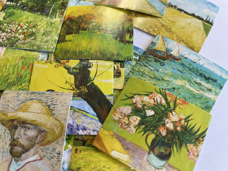 May include: A collection of vintage postcards featuring various paintings, including a landscape with a windmill, a field of flowers, a seascape with sailboats, and a still life with a vase of flowers.