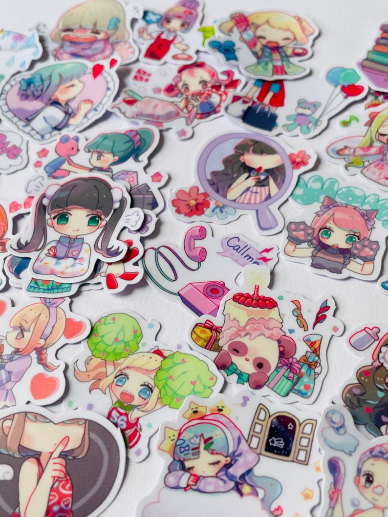 May include: A collection of colourful stickers featuring cartoon characters with different expressions and poses. The stickers are on a white background and include a variety of themes, such as animals, food, and everyday activities. Some of the stickers have text, such as "Call me".
