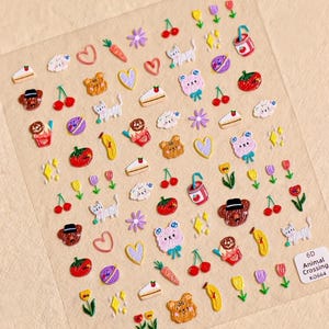 Könnte beinhalten: Ein Bogen mit bunten Aufklebern mit verschiedenen Designs, darunter Tiere, Lebensmittel und florale Elemente. Die Aufkleber zeigen eine Vielzahl von Formen und Farben, wie Herzen, Kirschen und Bären. Das Blatt enthält den Text "6D Animal Crossing K0664".