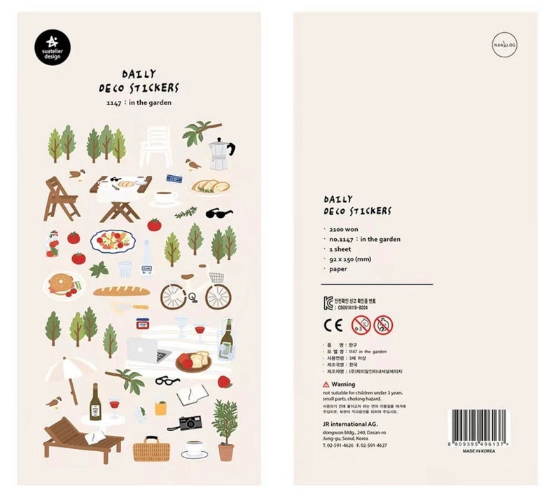 May include: A sheet of colorful stickers featuring illustrations of a picnic in the garden. The stickers include images of food, drinks, a bicycle, a laptop, a book, glasses, and more. The sticker sheet is labeled "Daily Deco Stickers" and "no. 1147: in the garden".