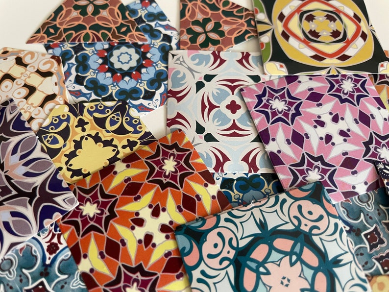 May include: A collection of colorful patterned paper squares with intricate geometric designs. The patterns feature a variety of colors, including red, blue, green, yellow, and purple.