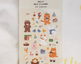 May include: A sheet of colorful stickers featuring cute animal illustrations, including a bear, a tiger, a cat, and a monkey. The stickers are perfect for adding a touch of whimsy to planners, journals, and other paper goods. The sheet also includes the text "DAILY DECO STICKERS" and "Say! Oh party day!"