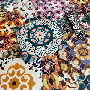 May include: A collection of colorful patterned ceramic tiles with intricate designs. The tiles are square and feature a variety of colors, including blue, red, yellow, and green. The designs are geometric and floral.