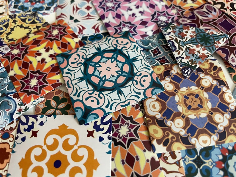 May include: A collection of colorful patterned ceramic tiles with intricate designs. The tiles are square and feature a variety of colors, including blue, red, yellow, and green. The designs are geometric and floral.