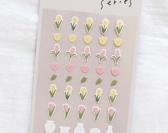 May include: A sheet of stickers featuring pink and yellow tulips, green leaves, and white vases. The stickers are part of a "mini series" and are labeled "NO. 126" and "FLOWER. 03".