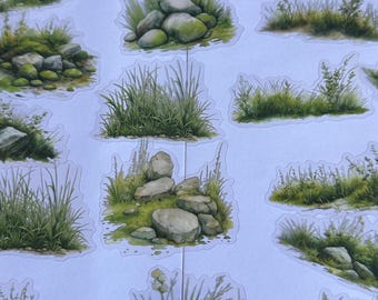 May include: A sheet of stickers featuring various green grass and rock formations. The stickers are perfect for adding a touch of nature to crafts, journals, and other projects.