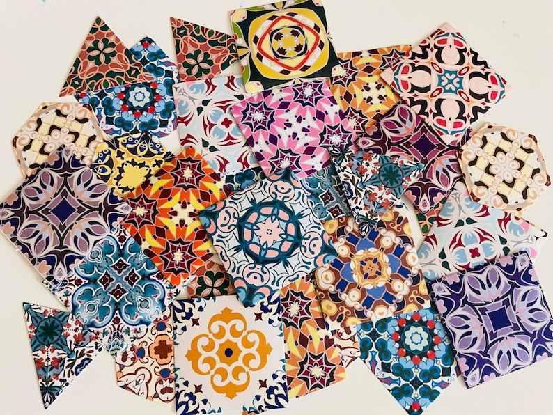 May include: A collection of colorful patterned tiles with intricate designs. The tiles are made of paper and feature a variety of geometric shapes and colors, including blue, red, yellow, green, and purple.