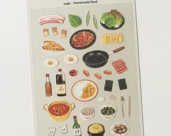 May include: A sheet of Daily Deco Stickers with illustrations of Korean food items. The stickers depict kimchi, rice, eggs, and other traditional dishes. The text "DAILY DECO STICKERS 1190: homemade food" is printed on the sheet.