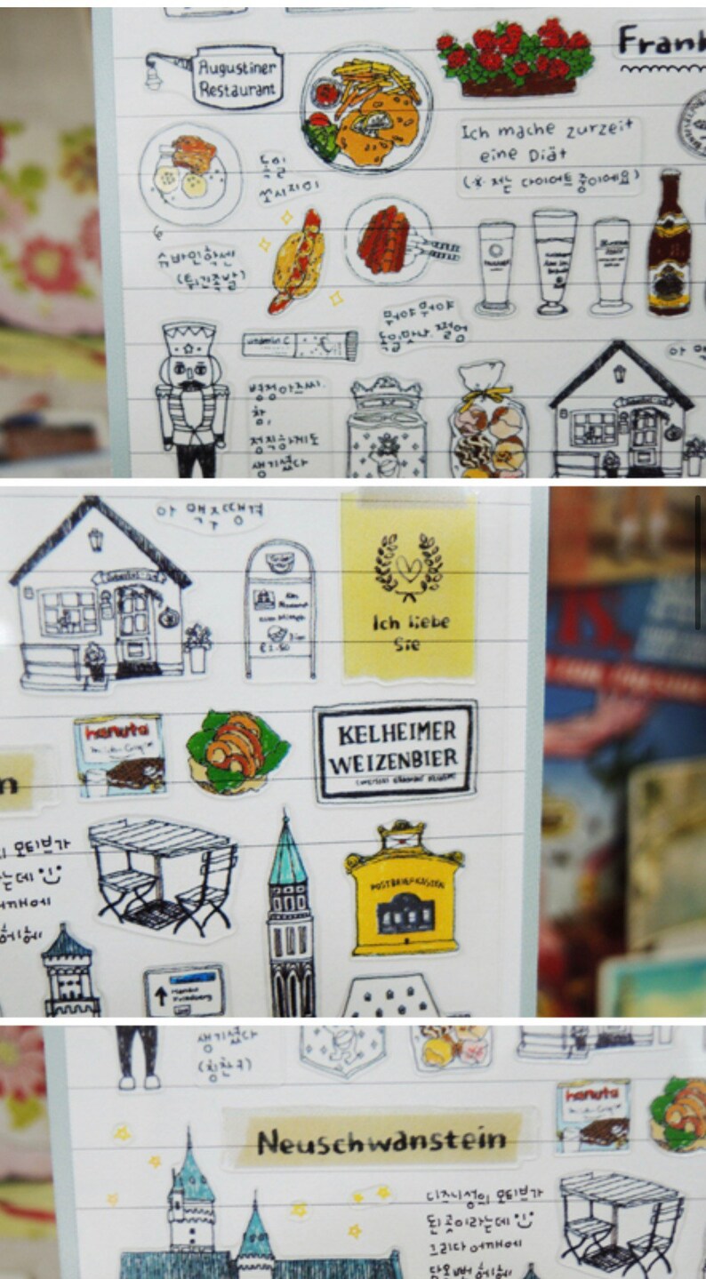 K&ouml;nnte beinhalten: Eine Bogen mit Aufklebern, die Illustrationen von deutschem Essen, Getr&auml;nken und Sehensw&uuml;rdigkeiten zeigen. Die Aufkleber sind auf durchsichtigem, transparentem Papier gedruckt und haben einen wei&szlig;en Hintergrund. Die Aufkleber enthalten Bilder von Brezeln, Bierkr&uuml;gen, einem Lebkuchenhaus, einem Schloss und einem Schild mit der Aufschrift "Ich liebe Sie" (Ich liebe dich).