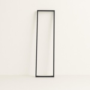 Contemporary minimalist black lamp frame, handmade in Italy. Sleek design, ideal for modern interiors. Lighting not included in this image.