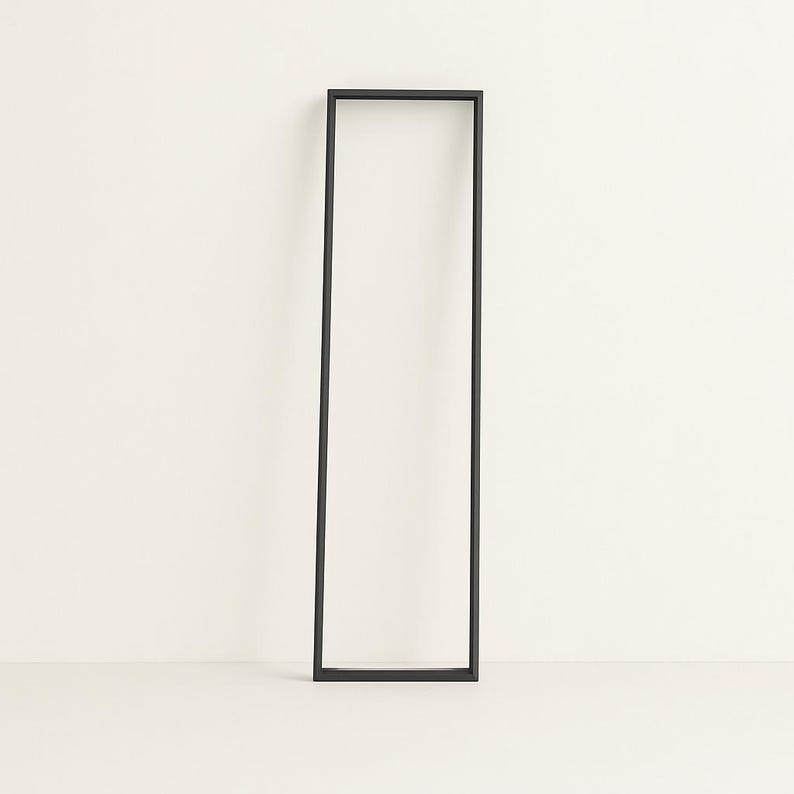 Contemporary minimalist black lamp frame, handmade in Italy. Sleek design, ideal for modern interiors. Lighting not included in this image.
