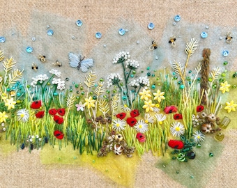 May include: A close-up of a needlepoint embroidery depicting a field of wildflowers. The flowers are red, yellow, and white, and there are also blue butterflies and green leaves. The background is a light blue sky with white clouds.