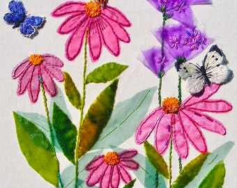 May include: Embroidered artwork featuring pink and purple flowers with butterflies. The flowers are made of fabric and have a 3D effect. The butterflies are also embroidered and have a realistic look.