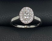 Natural diamond oval cut halo engagement ring 18ct white gold