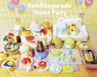 May include: A colorful display of Sumikkogurashi character figurines and accessories, including a couch, a chocolate fountain, a game board, and a variety of food items. The text "Sumikkogurashi Home Party" is visible in the image.  Sample display photo! All other items are not included (Sold separately).