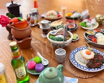 May include: A collection of miniature food items, including a bowl of soup, rice with a fried egg, and other dishes. A green teapot, a bottle of beer, and small desserts are also visible. The text "Sample display photo only! Other items are not included (Sold separately)" is present.