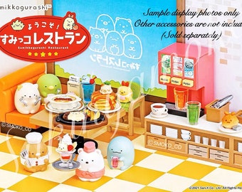 May include: A Sumikkogurashi restaurant playset with a variety of characters and accessories. The set includes a restaurant building, tables, chairs, food, and drinks. The characters are all from the Sumikkogurashi series, which is a popular Japanese character franchise. The set is made of plastic and is suitable for children ages 3 and up.