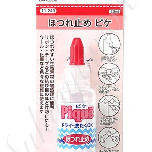 May include: A clear bottle of Pique fabric sealant with a red cap, designed to prevent fraying. The label includes Japanese text and illustrations showing its uses on fabric edges, ribbons, and button threads. The bottle contains 33ml of sealant.