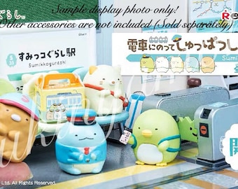 May include: A set of eight Sumikko Gurashi character figurines, each with a different pose and expression. The figurines are all wearing different outfits and accessories, and they are all standing on a small platform. The figurines are part of a collection called "Sumikko Station" and they are all made of plastic. The figurines are all about 2 inches tall.