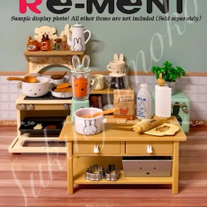 May include: A miniature kitchen scene with a stove, blender, and table. The scene includes a bunny-themed teapot, cups, and bowls. The text "Re-Ment" and "Sample display photo! All other items are not included (Sold separately)" are visible.