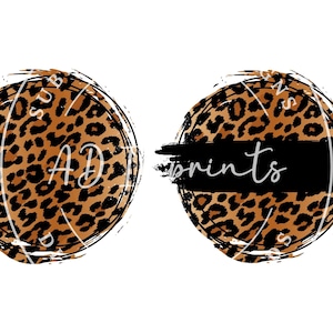 May include: Two round, brown and black leopard print designs with a black brush stroke across the middle. The top design says "SUB AD" and the bottom design says "prints".