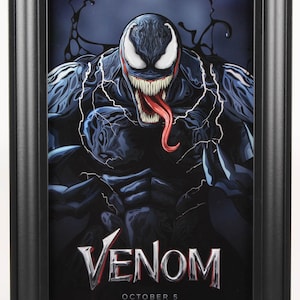 May include: A movie poster for the film "Venom" featuring Tom Hardy as the character Venom. The poster has a black background with a close-up of Venom's face. The text "Venom" is in large, white letters at the bottom of the poster. The release date "October 5" is below the title.