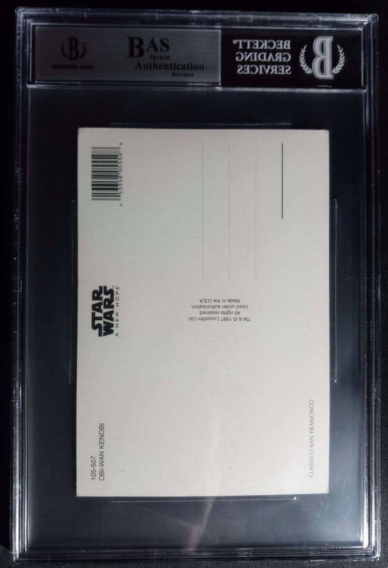 May include: A white postcard with a black and white image of Obi-Wan Kenobi from Star Wars: A New Hope. The back of the postcard has copyright information and the text "Made in the USA".