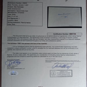 May include: A letter of authenticity for a signature of Alec Guinness, dated January 7, 2021, with a certification number BB91746. The document is on a white background with blue text and a blue signature. The document is signed by James J. Spence, III, Vice President of James Spence Authentication, LLC.