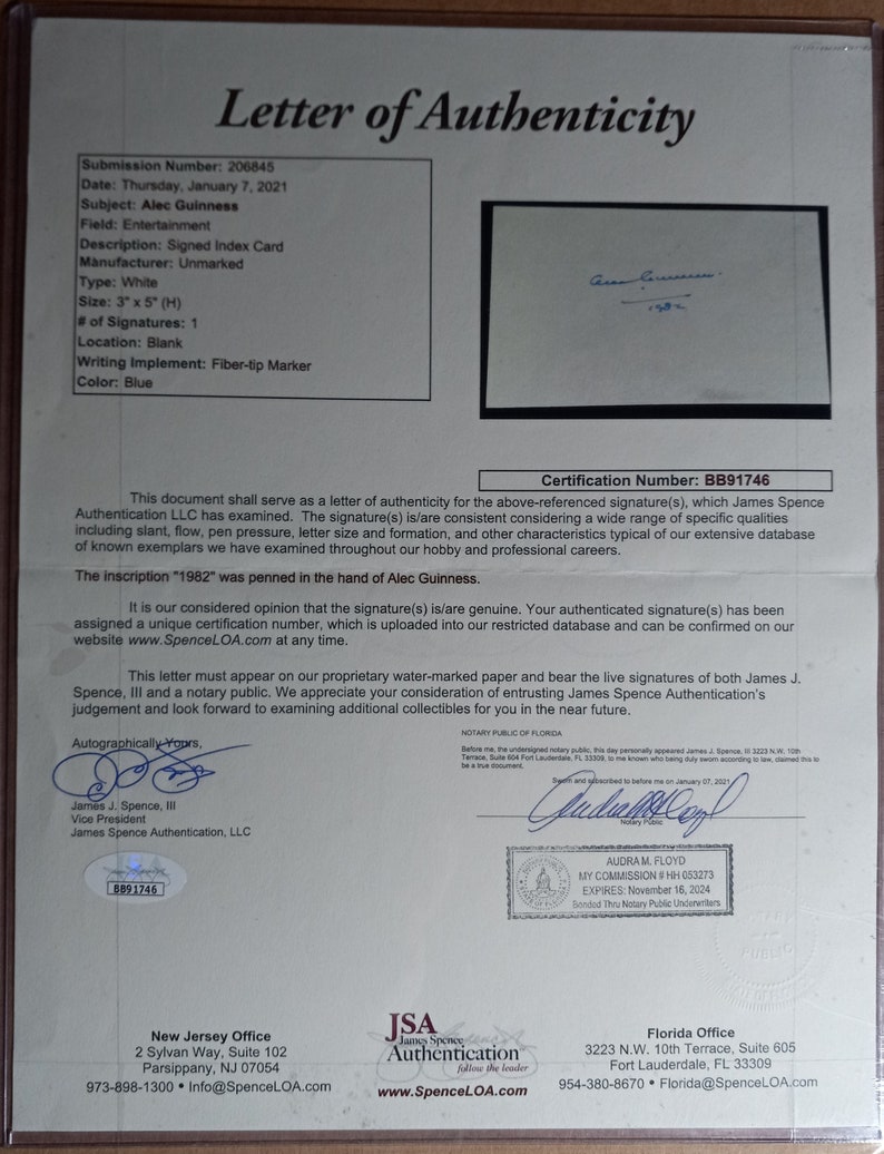 May include: A letter of authenticity for a signature of Alec Guinness, dated January 7, 2021, with a certification number BB91746. The document is on a white background with blue text and a blue signature. The document is signed by James J. Spence, III, Vice President of James Spence Authentication, LLC.
