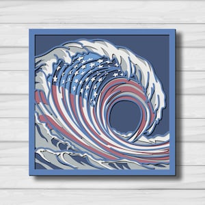 May include: A square multi-layered wall art piece featuring a stylized ocean wave design. The wave incorporates the red, white, and blue colors of the American flag, with white stars integrated into the crest of the wave against a dark blue background.
