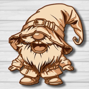 May include: A layered wooden cutout of a gnome featuring a tall, floppy hat with a buckle detail, a large nose, a wide open mouth, and a long, textured beard. The design uses various shades of light and dark brown wood to create depth.