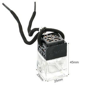 May include: A clear glass square bottle with a black decorative cap featuring a cutout pattern. The bottle is attached to a black cord for hanging. Dimensions are indicated as 25mm by 25mm at the base with a total height of 45mm.